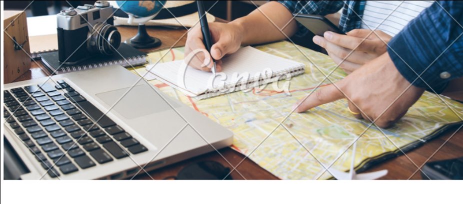 Planning a trip with a laptop, map, camera, notebook, and globe.